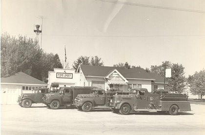 1950's fleet shot by orginal firehouse (now Erv's)