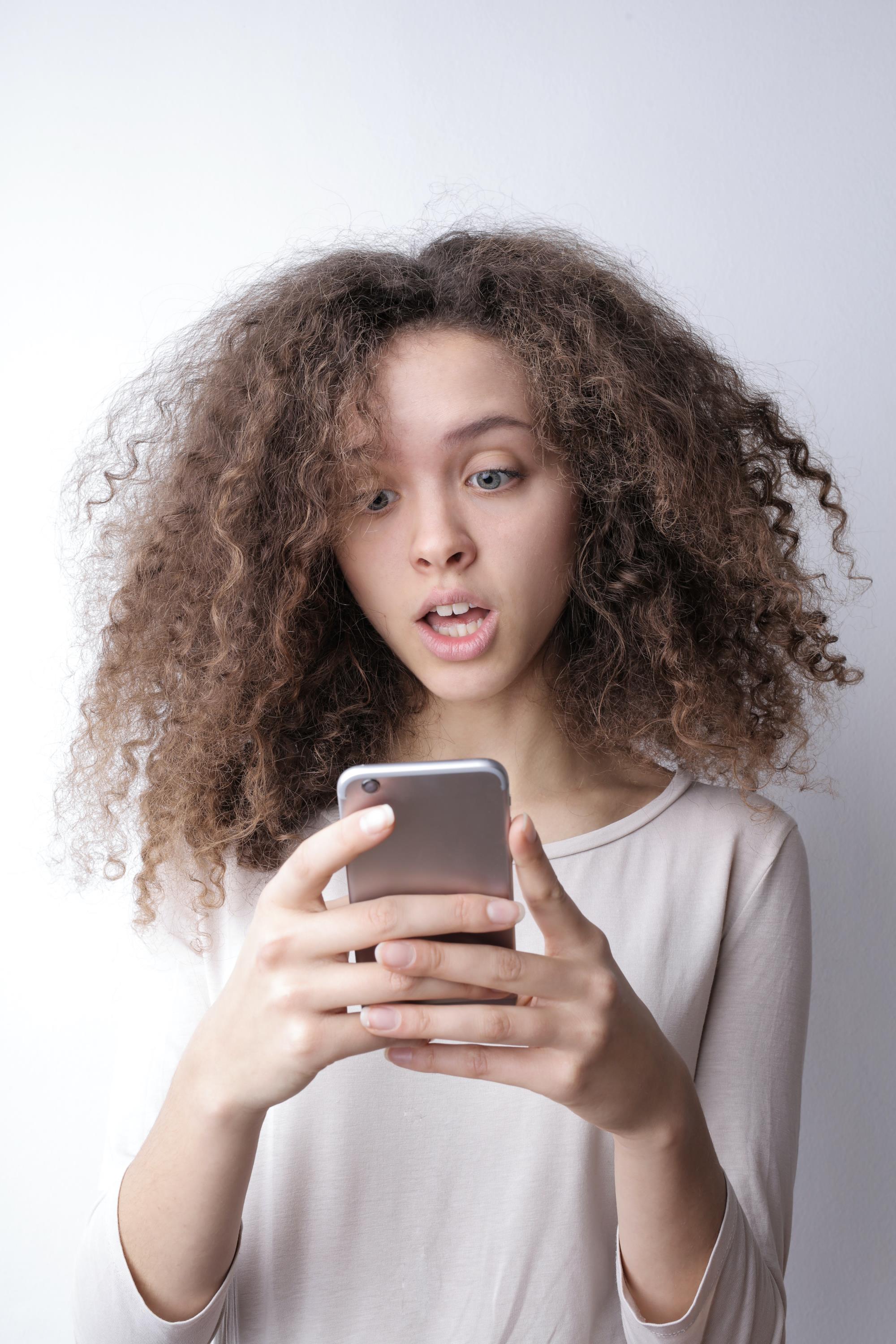 Woman Surprised on Phone