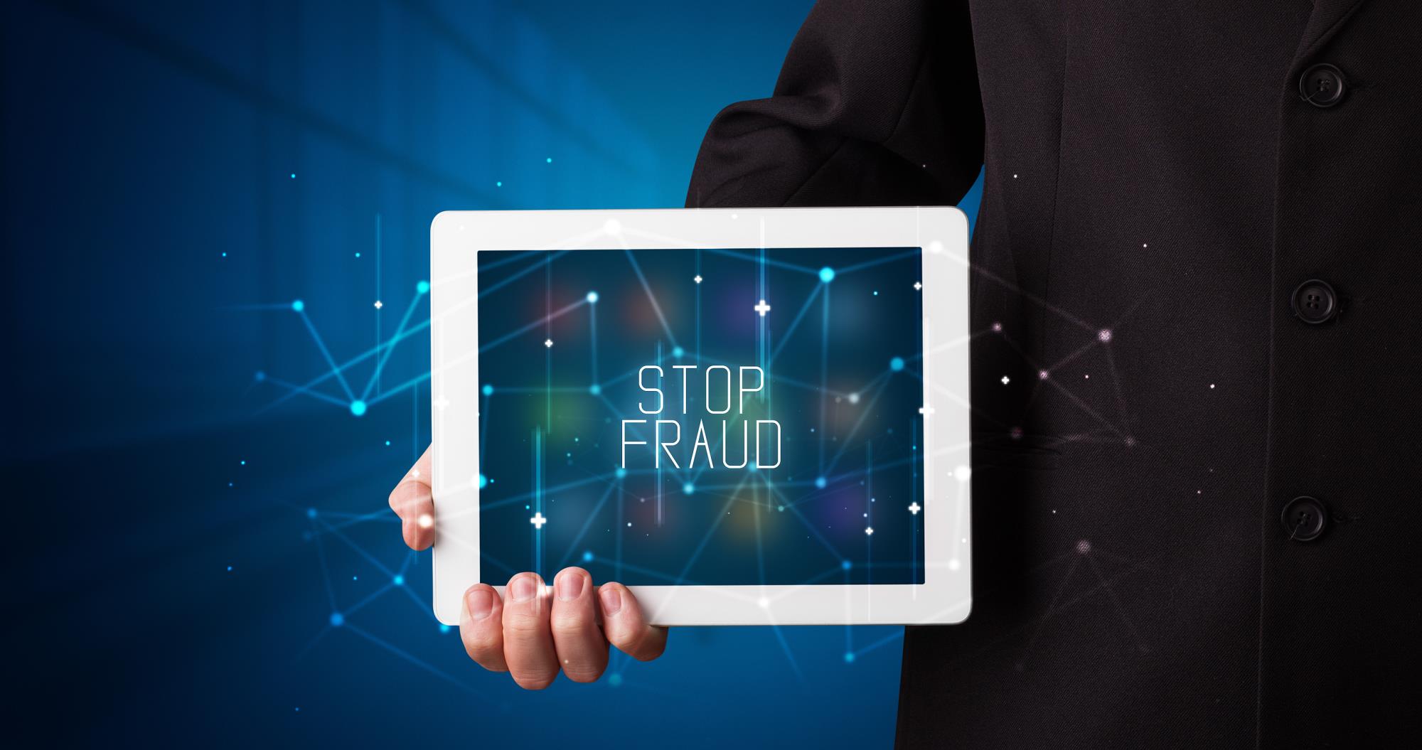 Tablet with stop fraud on screen