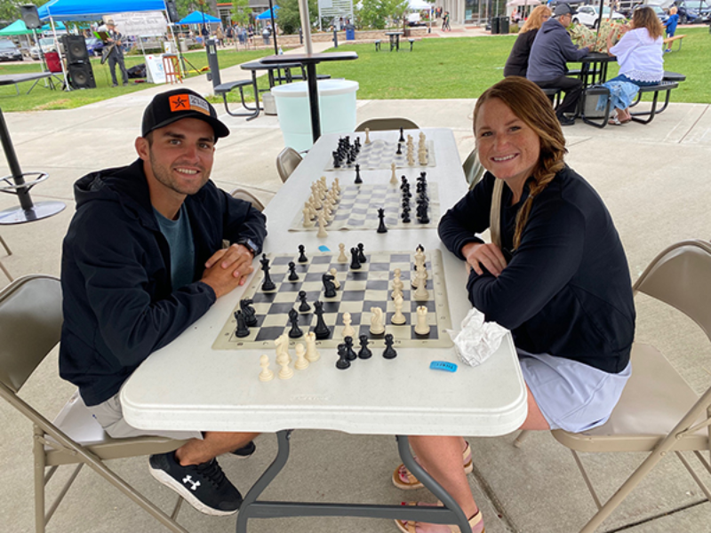 A man and woman playing chess