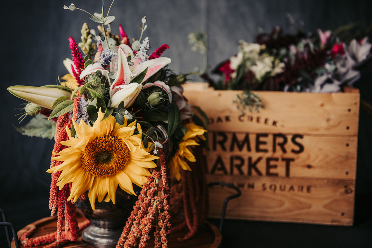 Flower arrangement in front of wooden crate