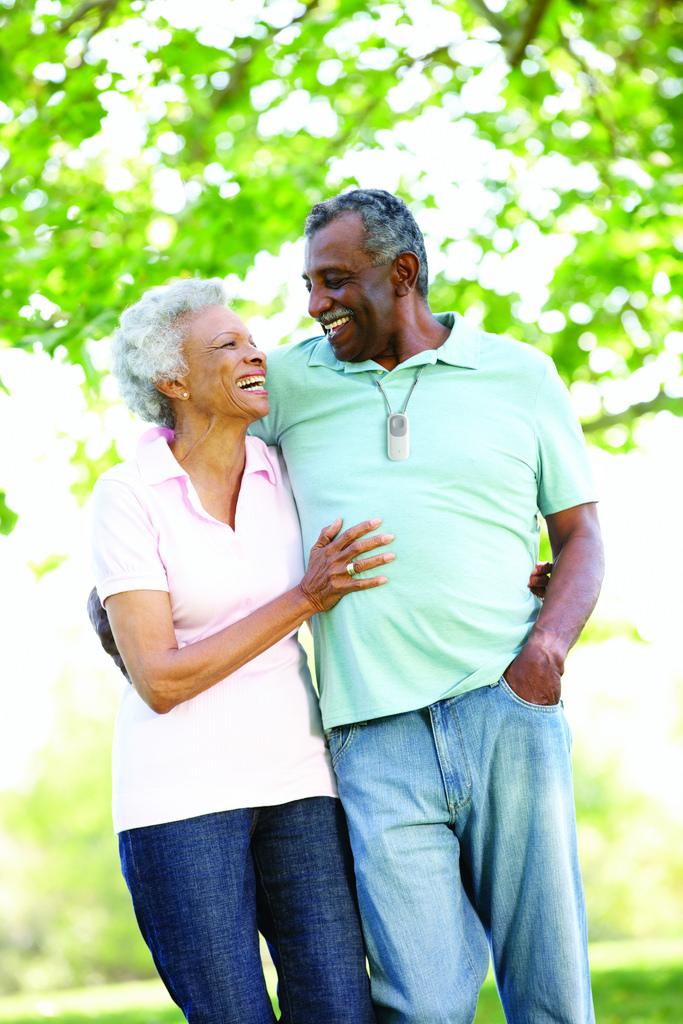 Two smiling adults in park